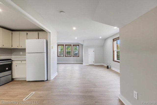 45866 Gable Inn St, Shelby Twp, MI 48317 - kitchen featuring freestanding refrigerator, stainless steel electric range, light wood-style flooring, recessed lighting, and light countertops