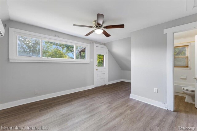 45866 Gable Inn St, Shelby Twp, MI 48317 - additional living space with vaulted ceiling, a ceiling fan, and wood finished floors
