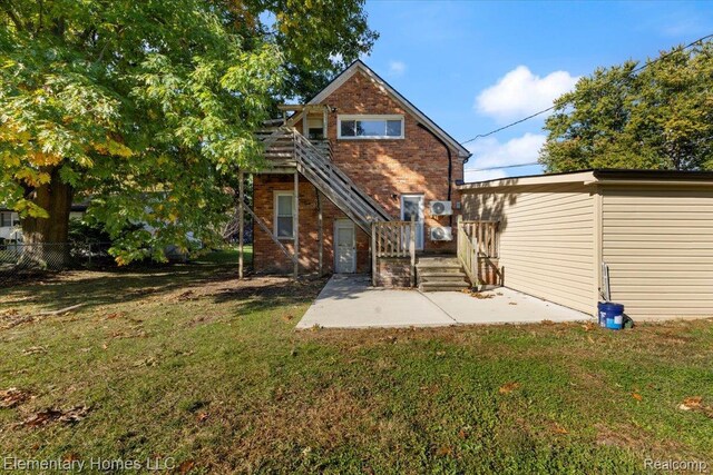 45866 Gable Inn St, Shelby Twp, MI 48317 - back of house with brick siding and a patio area