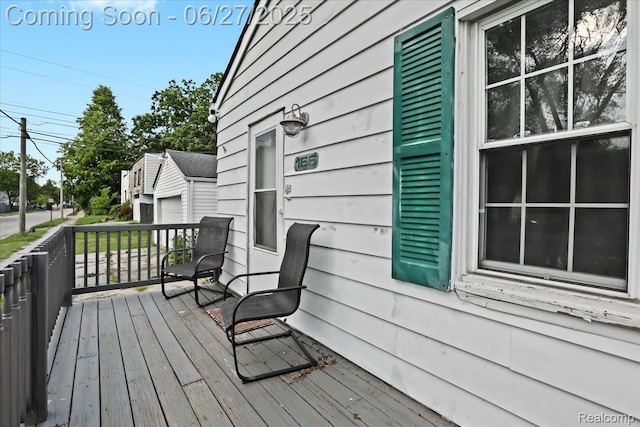 166 W Milton Ave, Oak Park, MI 48030 - wooden deck with a garage