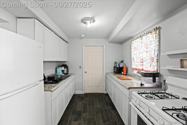 166 W Milton Ave, Oak Park, MI 48030 - kitchen featuring white appliances, white cabinets, and dark wood-type flooring