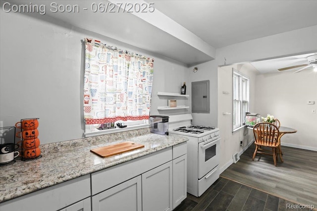166 W Milton Ave, Oak Park, MI 48030 - kitchen featuring white gas range, electric panel, dark wood finished floors, ceiling fan, and light stone counters