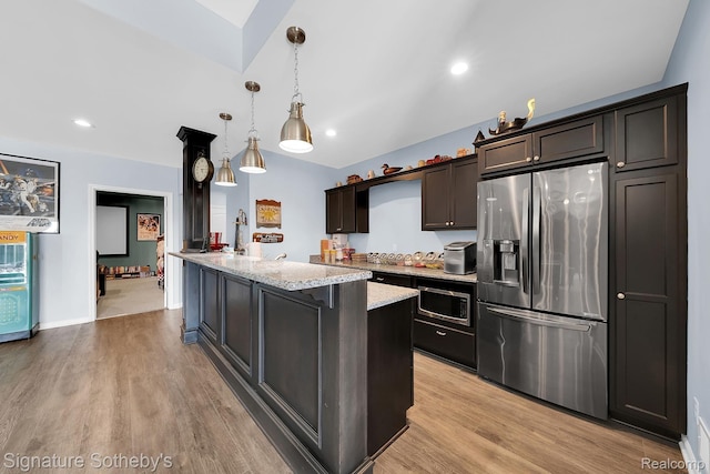 5001 Forest Vly, Clarkston, MI 48348 - kitchen with appliances with stainless steel finishes, light wood-type flooring, light stone countertops, decorative light fixtures, and recessed lighting