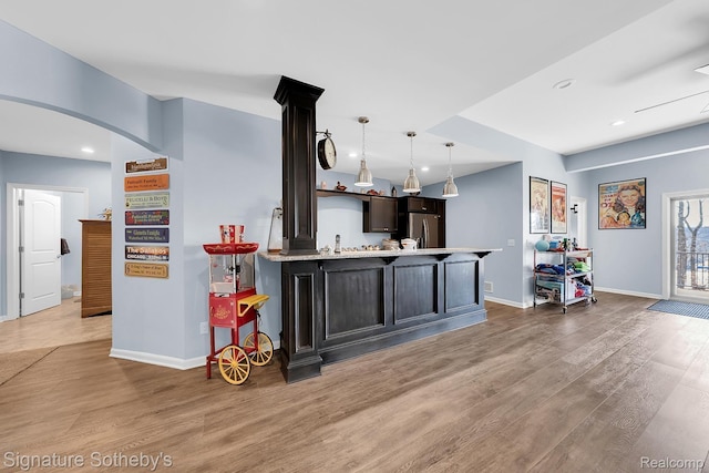 5001 Forest Vly, Clarkston, MI 48348 - kitchen with light wood finished floors, light countertops, stainless steel refrigerator with ice dispenser, pendant lighting, and recessed lighting