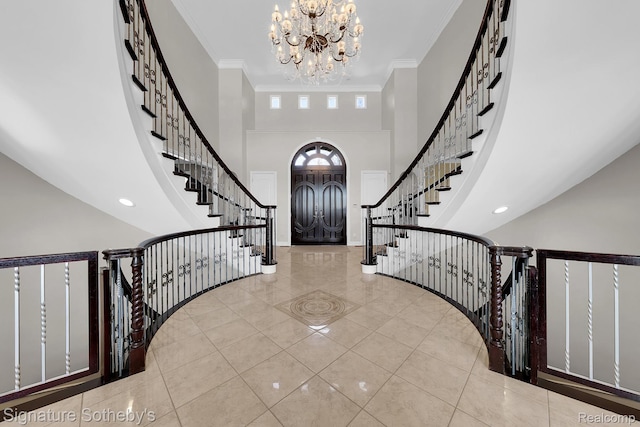 5001 Forest Vly, Clarkston, MI 48348 - foyer entrance featuring a chandelier, tile patterned floors, a high ceiling, stairway, and ornamental molding