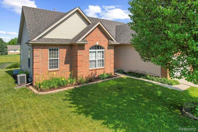 70298 Sunny Brook Ln, Macomb, MI 48062 - view of front of house with brick siding, a front yard, and a shingled roof