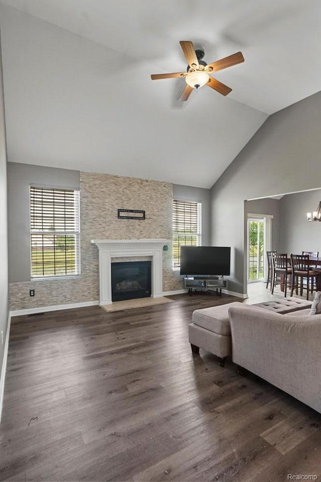 70298 Sunny Brook Ln, Macomb, MI 48062 - living room featuring a fireplace with flush hearth, plenty of natural light, ceiling fan, and high vaulted ceiling