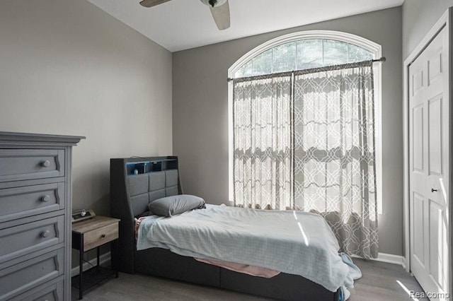70298 Sunny Brook Ln, Macomb, MI 48062 - bedroom with light wood-style floors, ceiling fan, and lofted ceiling