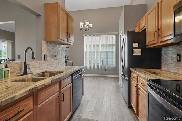 70298 Sunny Brook Ln, Macomb, MI 48062 - kitchen with light stone countertops, dishwasher, light wood finished floors, tasteful backsplash, and electric range