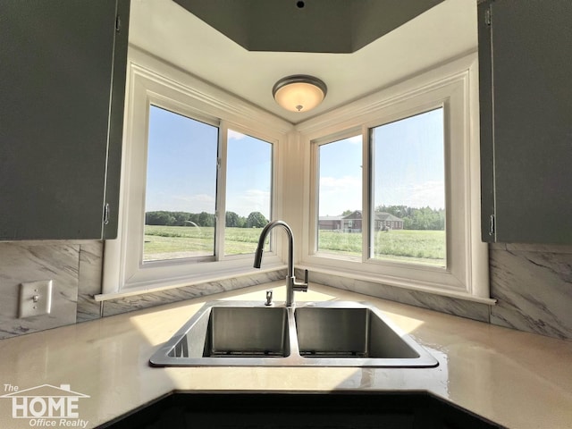 10306 Reid Rd, Swartz Creek, MI 48473 - kitchen featuring light countertops and a sink