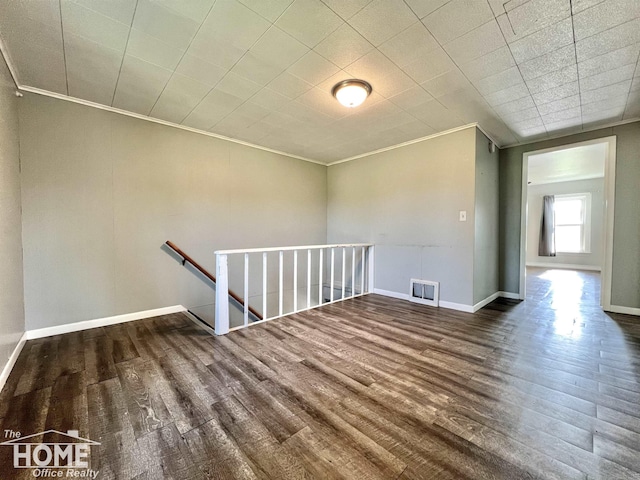 10306 Reid Rd, Swartz Creek, MI 48473 - spare room with wood finished floors and crown molding