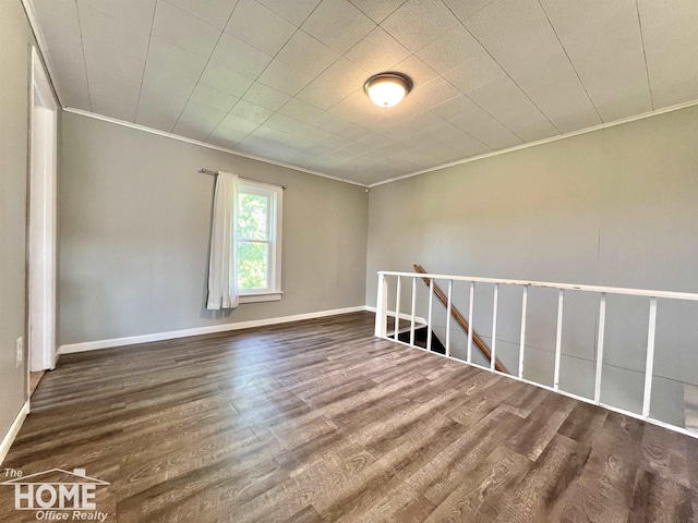 10306 Reid Rd, Swartz Creek, MI 48473 - spare room with crown molding and wood finished floors