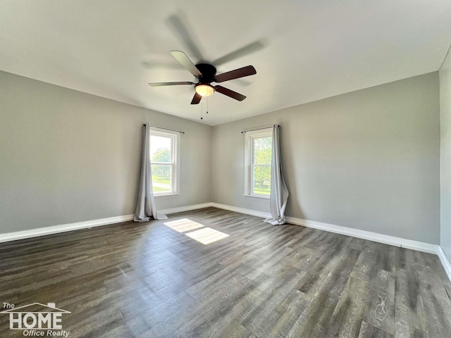 10306 Reid Rd, Swartz Creek, MI 48473 - unfurnished room featuring ceiling fan and dark wood finished floors