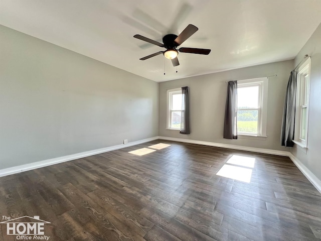 10306 Reid Rd, Swartz Creek, MI 48473 - empty room with dark wood finished floors and ceiling fan