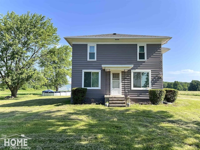 10306 Reid Rd, Swartz Creek, MI 48473 - rear view of property with a lawn