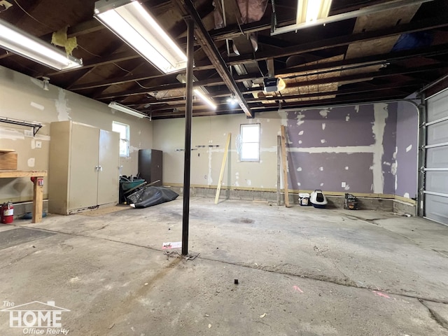 10306 Reid Rd, Swartz Creek, MI 48473 - garage featuring a garage door opener