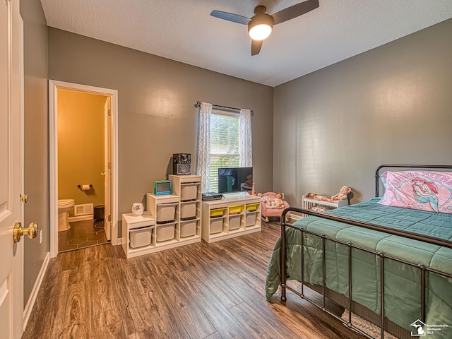 5257 Torrington Dr, Monroe, MI 48161 - bedroom featuring wood finished floors, ensuite bathroom, a ceiling fan, and a textured ceiling