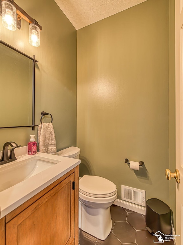 5257 Torrington Dr, Monroe, MI 48161 - bathroom with vanity, tile patterned flooring, and a textured ceiling