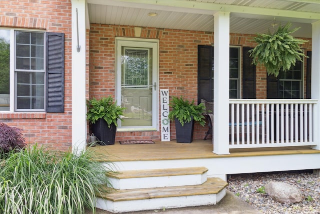 6212 Sagamore Ln, Kalamazoo, MI 49004 - view of exterior entry with brick siding and covered porch