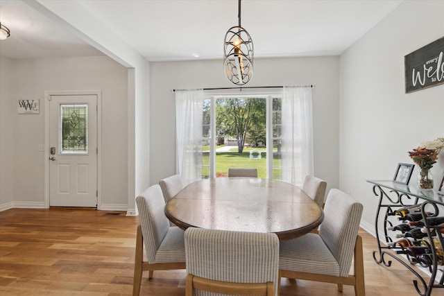 6212 Sagamore Ln, Kalamazoo, MI 49004 - dining area with light wood-type flooring and baseboards