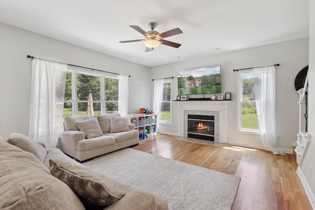 6212 Sagamore Ln, Kalamazoo, MI 49004 - living room featuring plenty of natural light, wood finished floors, and a fireplace with flush hearth