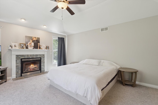 6212 Sagamore Ln, Kalamazoo, MI 49004 - bedroom featuring carpet, a tiled fireplace, vaulted ceiling, and a ceiling fan