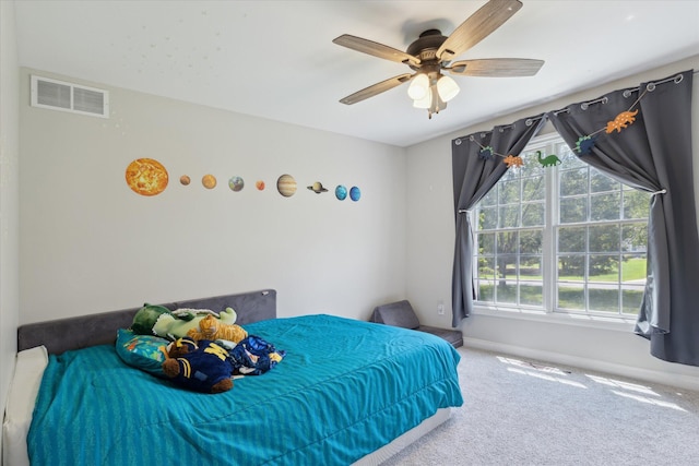 6212 Sagamore Ln, Kalamazoo, MI 49004 - carpeted bedroom with baseboards and a ceiling fan