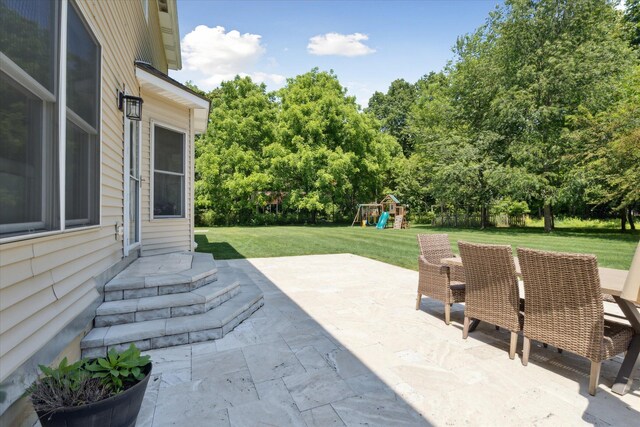 6212 Sagamore Ln, Kalamazoo, MI 49004 - view of patio / terrace featuring a playground and view of scattered trees