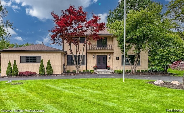 4462 Barchester Dr, Bloomfield Hills, MI 48302 - view of front of home with a balcony, a front yard, brick siding, and french doors