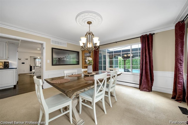 4462 Barchester Dr, Bloomfield Hills, MI 48302 - dining area with crown molding, baseboard heating, a chandelier, wainscoting, and light colored carpet