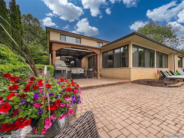 4462 Barchester Dr, Bloomfield Hills, MI 48302 - rear view of property featuring brick siding and a patio