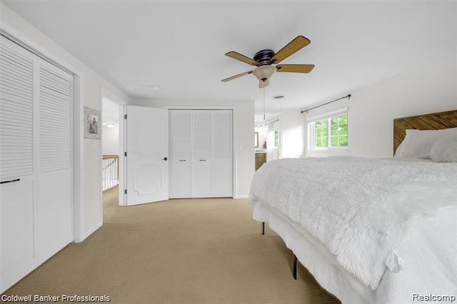 4462 Barchester Dr, Bloomfield Hills, MI 48302 - carpeted bedroom featuring multiple closets and a ceiling fan