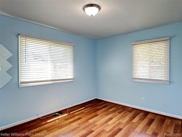 20839 Sunset Ave, Warren, MI 48091 - empty room with plenty of natural light and wood finished floors