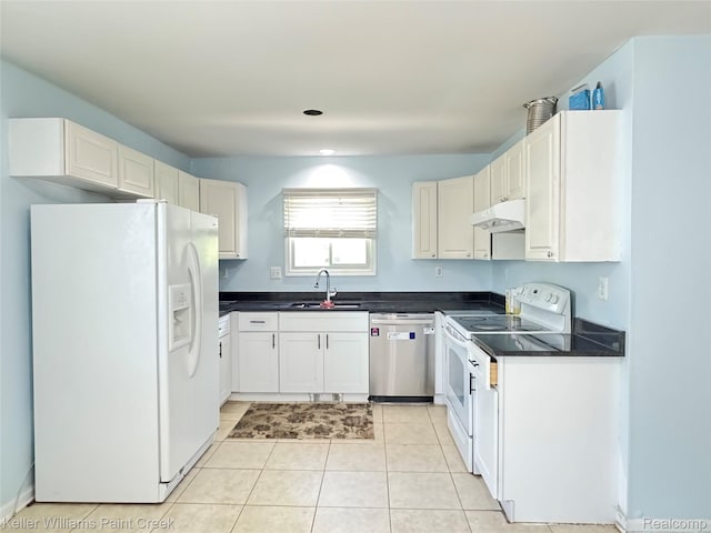 20839 Sunset Ave, Warren, MI 48091 - kitchen featuring white appliances, under cabinet range hood, dark countertops, and light tile patterned floors