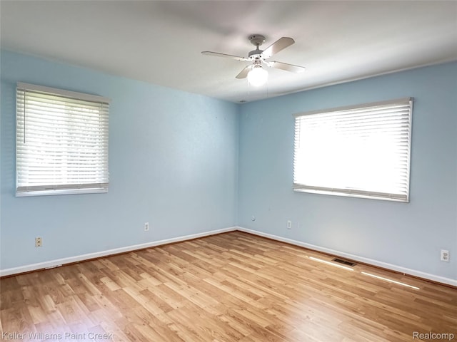 20839 Sunset Ave, Warren, MI 48091 - unfurnished room with healthy amount of natural light, a ceiling fan, and wood finished floors