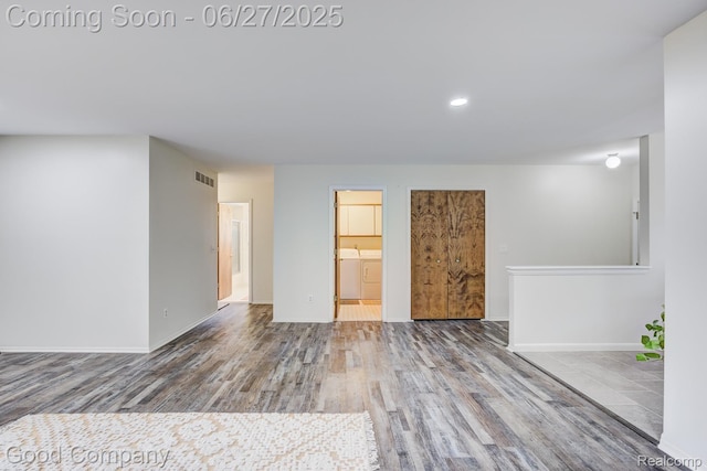 45264 Universal Ct, Shelby Twp, MI 48317 - unfurnished room featuring washer and clothes dryer, wood finished floors, and recessed lighting
