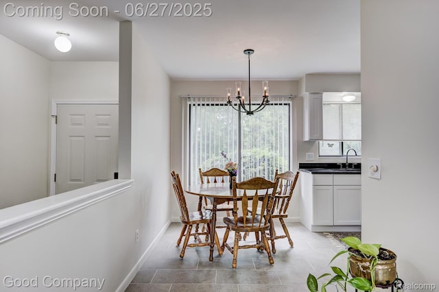 45264 Universal Ct, Shelby Twp, MI 48317 - dining area with a chandelier and baseboards
