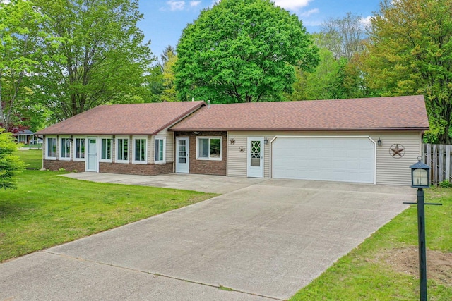 205 Alexander St, Cadillac, MI 49601 - single story home featuring a garage and driveway