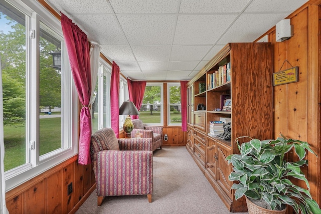 205 Alexander St, Cadillac, MI 49601 - sitting room with a drop ceiling, light carpet, and wood walls