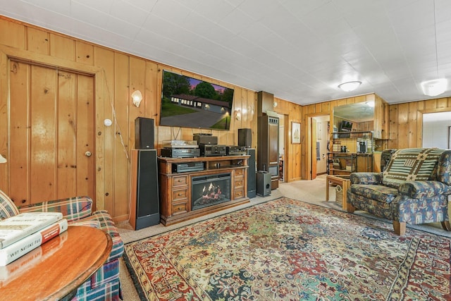 205 Alexander St, Cadillac, MI 49601 - living room with light carpet and wood walls