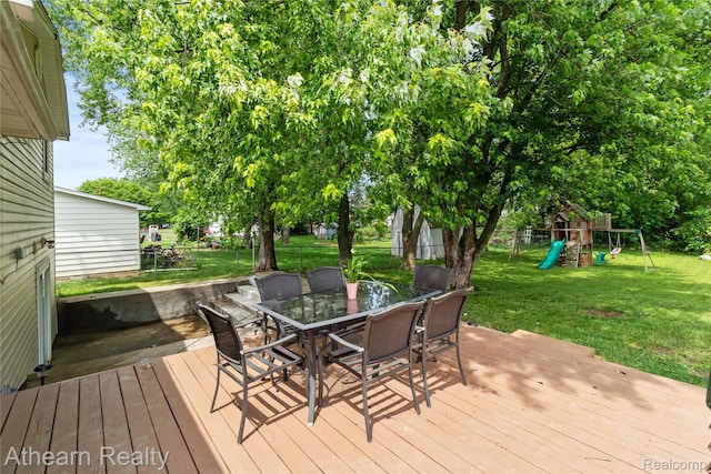 4438 Bridgeman Trl, Swartz Creek, MI 48473 - deck featuring a playground and outdoor dining area