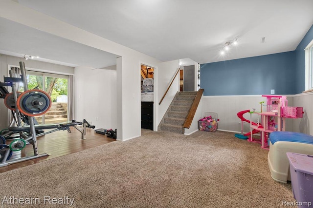 4438 Bridgeman Trl, Swartz Creek, MI 48473 - rec room featuring a wainscoted wall, carpet flooring, and rail lighting