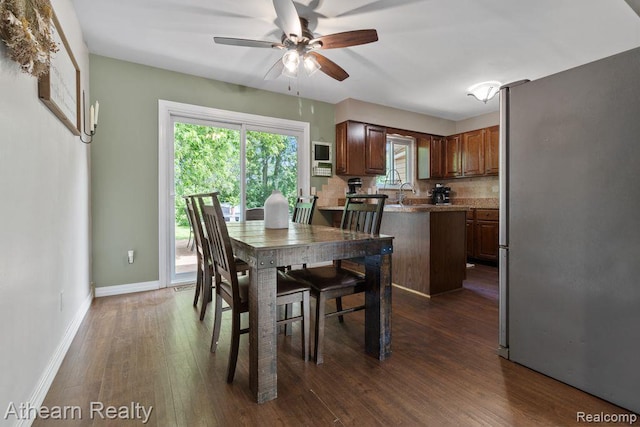 4438 Bridgeman Trl, Swartz Creek, MI 48473 - dining room featuring ceiling fan and dark wood-type flooring