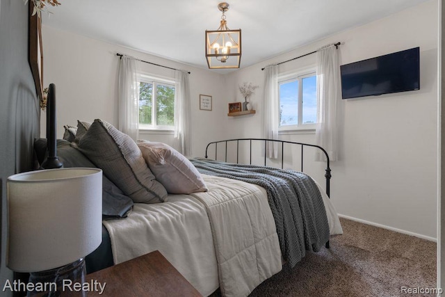 4438 Bridgeman Trl, Swartz Creek, MI 48473 - bedroom featuring a chandelier and carpet flooring