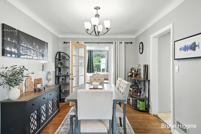 920 Graceland St NE, Grand Rapids, MI 49505 - dining area featuring a chandelier and dark wood-type flooring