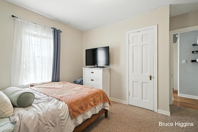920 Graceland St NE, Grand Rapids, MI 49505 - bedroom with multiple windows and light carpet