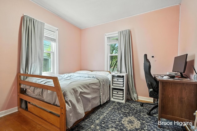 920 Graceland St NE, Grand Rapids, MI 49505 - bedroom with multiple windows, an office area, and wood finished floors