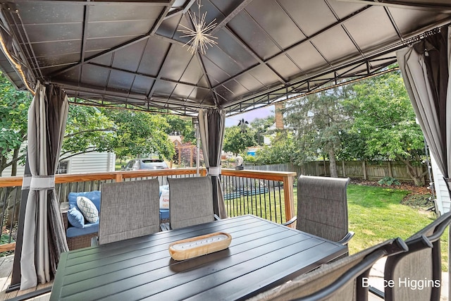 920 Graceland St NE, Grand Rapids, MI 49505 - deck featuring a fenced backyard, a gazebo, and outdoor dining space
