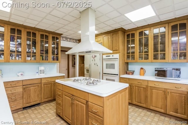 31085 Estate Woods Ct, Farmington Hills, MI 48331 - kitchen with white appliances, island exhaust hood, light countertops, light flooring, and a drop ceiling