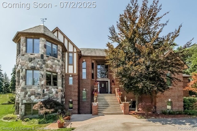 31085 Estate Woods Ct, Farmington Hills, MI 48331 - tudor house featuring brick siding and stone siding